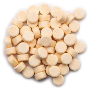 Bright yellow pressed tablets