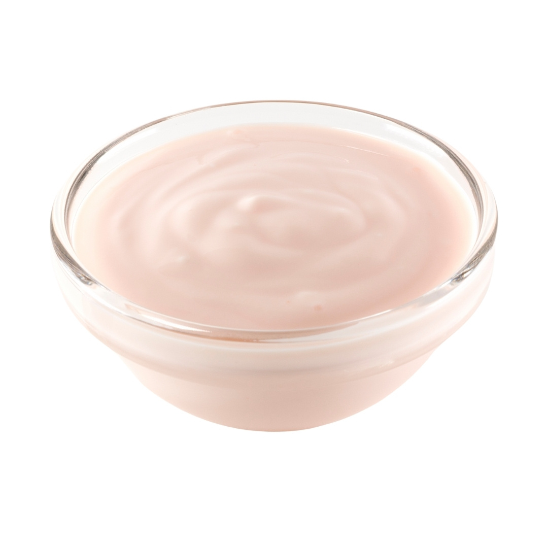 Orange cream cheese in a small glass bowl